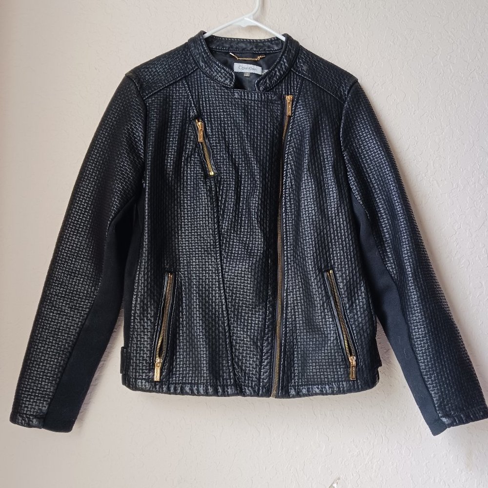Calvin Klein black with gold zippers and snaps.
